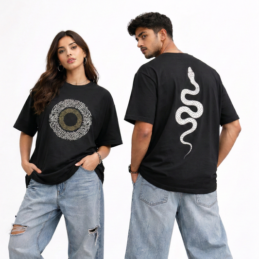 Two people wearing black t-shirts with graphic designs, standing side by side on a light background.